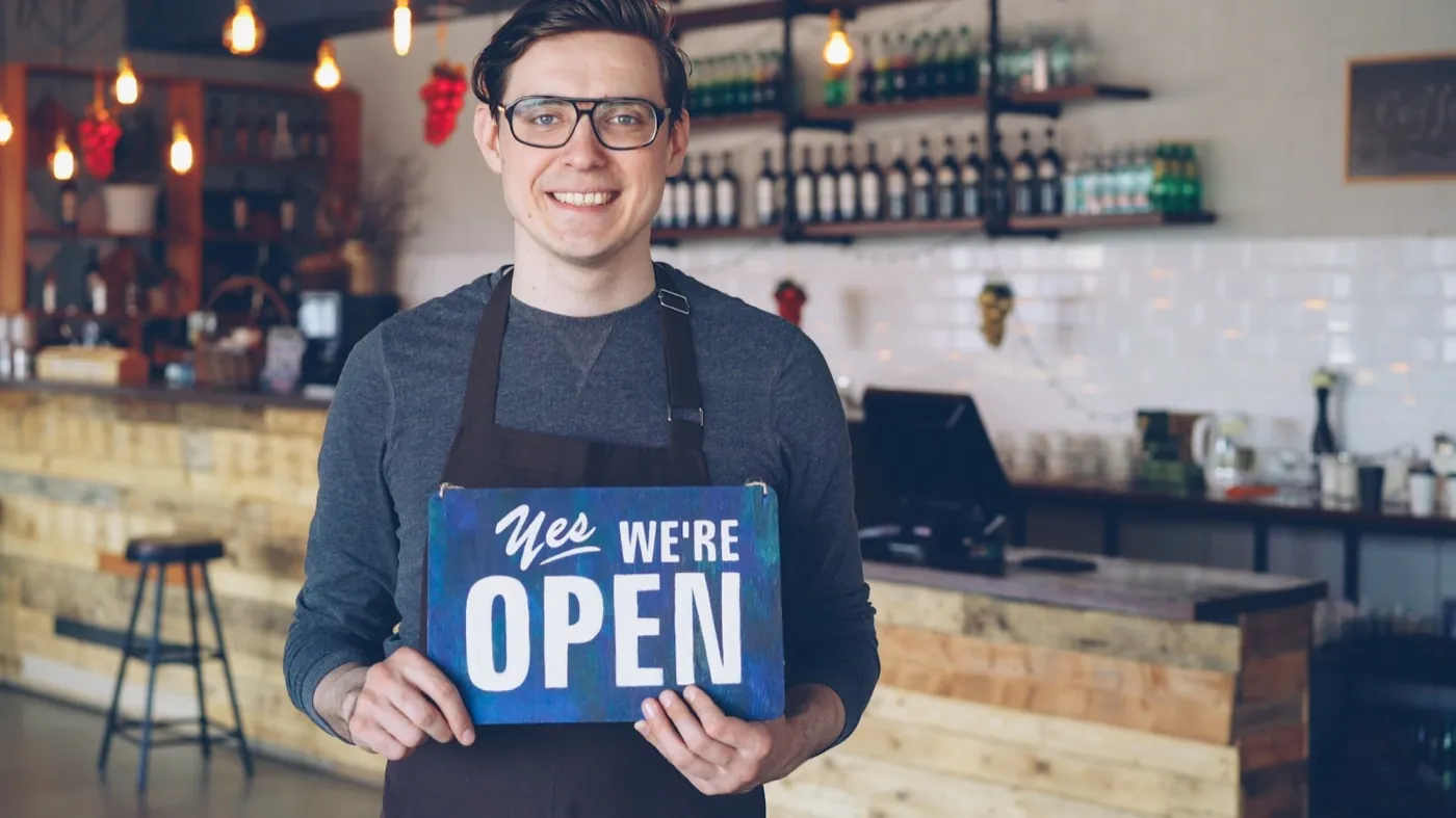 A business owner open and ready for customers